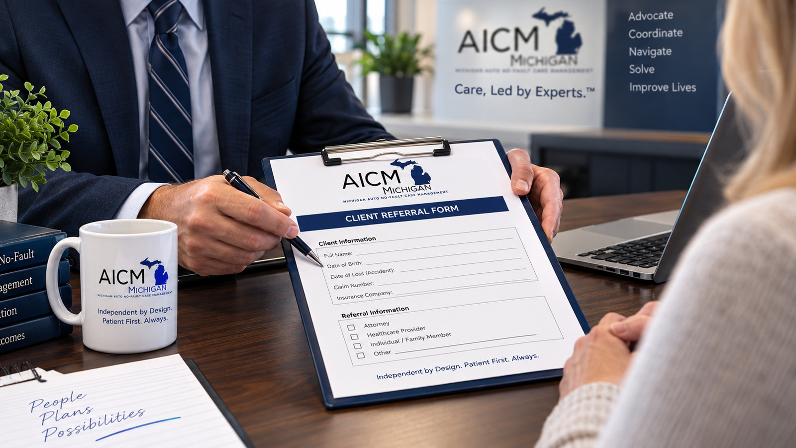 Professional reviewing referral paperwork for Michigan Auto No-Fault Case Management